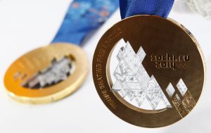 The gold and bronze medals manufactured for the 2014 Winter Olympic Games in Sochi are seen on display at the Adamas jewellery factory in Moscow
